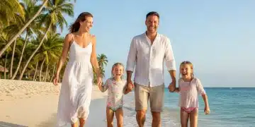 Happy family enjoying a beach vacation, symbolizing successful travel fund savings.